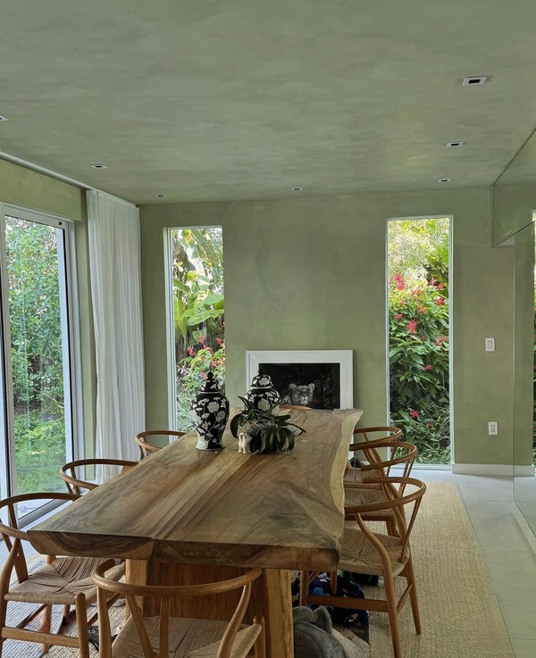 green color with hints of yellow "Vetiver" limewash finish on walls and ceiling shown in a living room